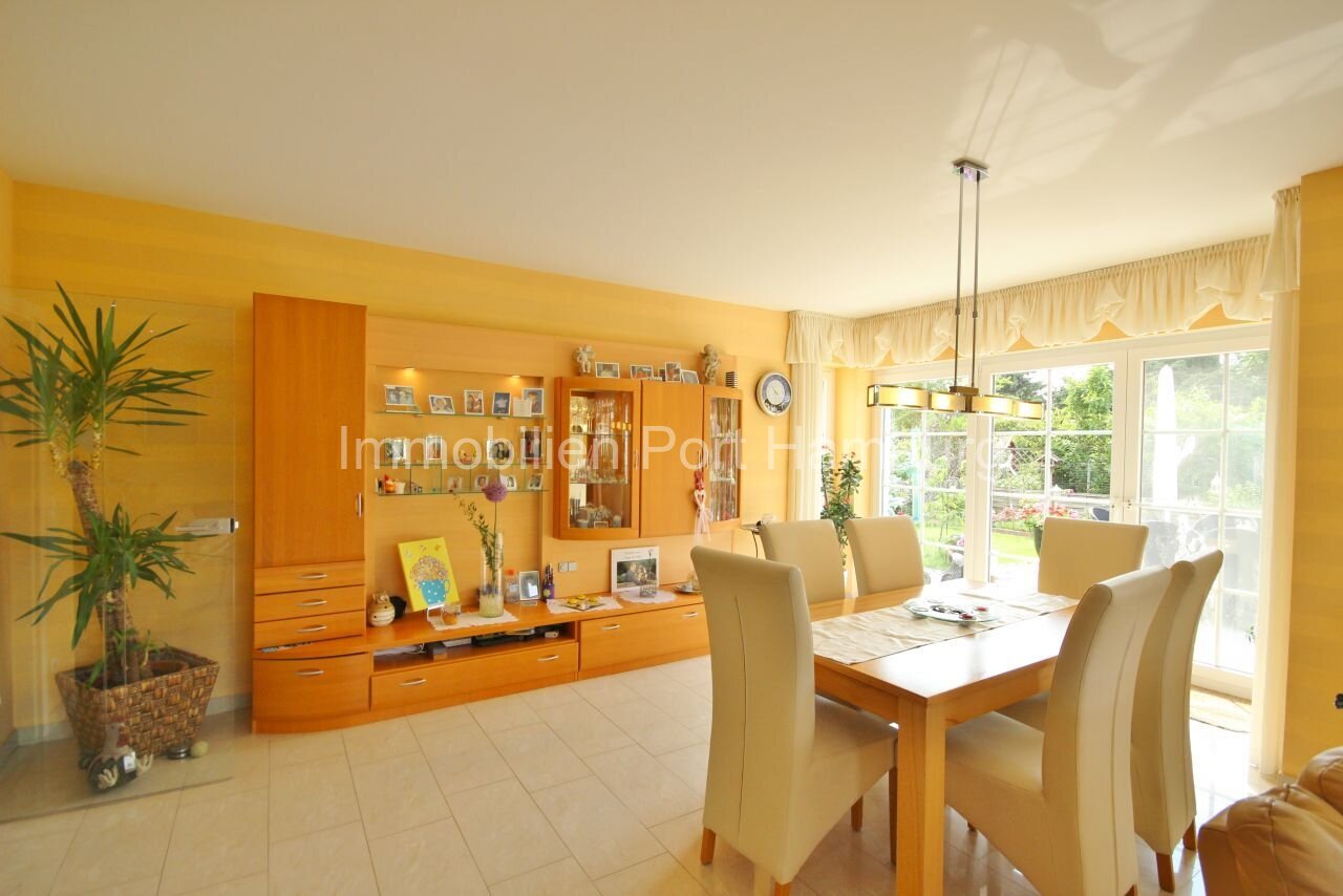 Bright living-dining area with custom-made wall unit and direct garden access Bright living-dining area with custom-made wall unit and direct garden access